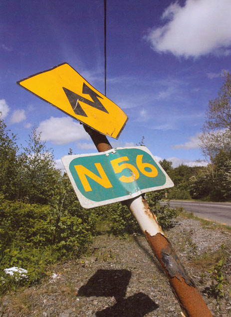 rusty road sign