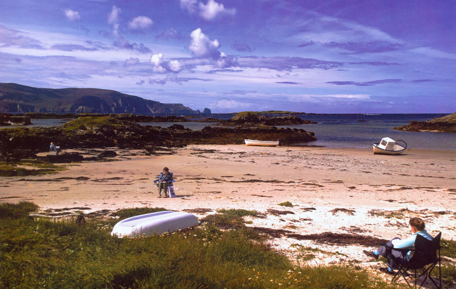 people sitting on port na blagh beach