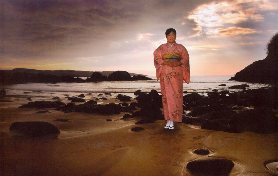 aisian woman standing on a beach