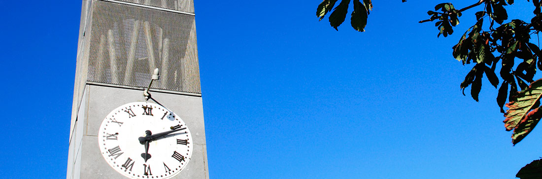photo of the clock tower with blue sky in the background