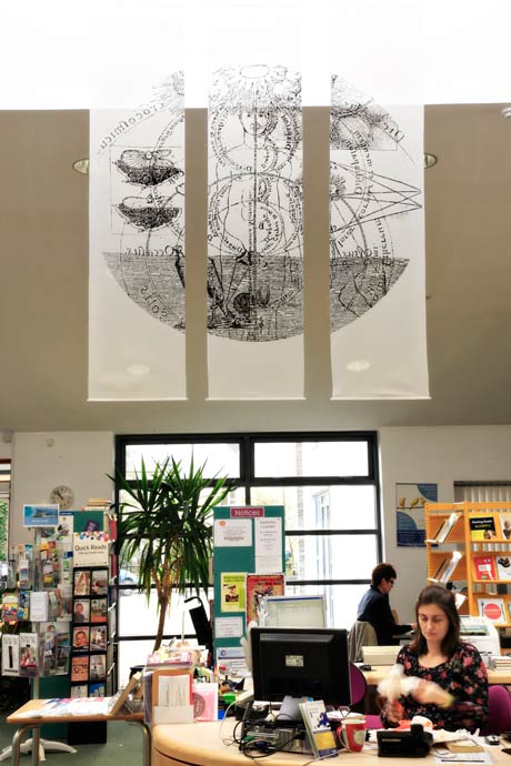 photo of the Enlightment wall hanging in the library